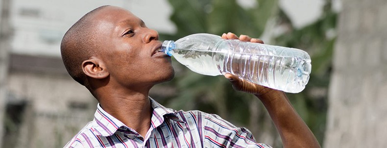 man drinking clean bottled water.
